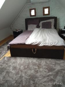 Кровать или кровати в номере Kemencés Vendégház