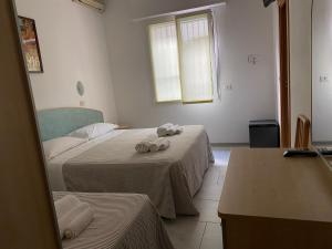 Postel nebo postele na pokoji v ubytování Hotel Chery