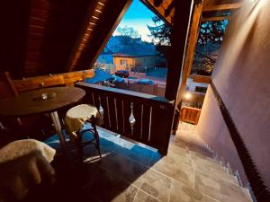 a view from the balcony of a house with a table and chairs at Casa Felice in Braşov