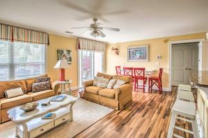 a living room with a couch and a table at Bermuda Bay Home - Gated Oceanfront Community in Myrtle Beach