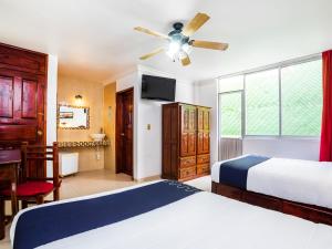 Postel nebo postele na pokoji v ubytování Hotel HC