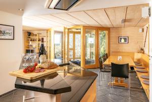 a kitchen and dining room with a table and chairs at Chalet Steingärtli 1 in Wengen