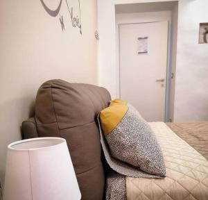 Postel nebo postele na pokoji v ubytování B&B Piano Romano -con parcheggio privato gratuito-