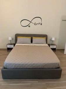 Postel nebo postele na pokoji v ubytování B&B Piano Romano -con parcheggio privato gratuito-