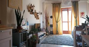 a living room filled with lots of plants at Your Room in Catania in Catania