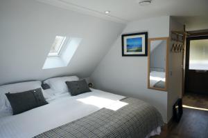 Un pat sau paturi într-o cameră la Hazelbank