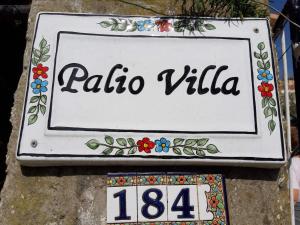 a sign that says raalo villa on a wall at Palio Villa in Paleo Tsifliki