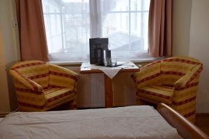 Uma cama ou camas num quarto em Rathskeller Weitra