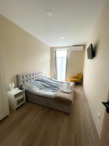 Posteľ alebo postele v izbe v ubytovaní Holiday Apartmanház