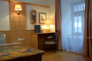 Uma cama ou camas num quarto em Rathskeller Weitra