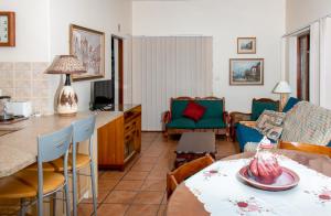 a living room with a table and a couch at Columba 33 in Suiderkruis