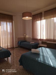 Postel nebo postele na pokoji v ubytování Hotel Maria