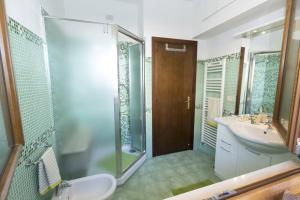 a bathroom with a toilet and a sink and a shower at A letto nell'Arte in Ascoli Piceno +64 photos