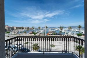 a balcony with a view of a harbor at L'Aragosta in Alghero