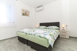 Posteľ alebo postele v izbe v ubytovaní Luxury apartment with swimming pool Ana