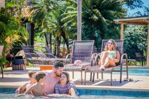 a family in the swimming pool at a resort at Zagaia Eco Resort in Bonito