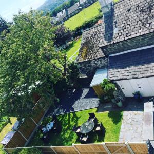 an overhead view of a backyard with a table and chairs at Llety Brynawel Guest House in Pennal