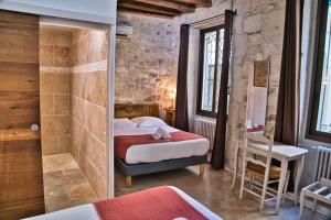 Postel nebo postele na pokoji v ubytování Hôtel La Muette
