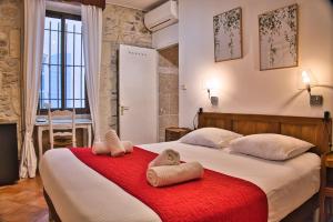 Postel nebo postele na pokoji v ubytování Hôtel La Muette