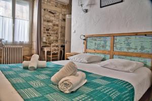 Postel nebo postele na pokoji v ubytování Hôtel La Muette