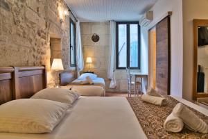 Postel nebo postele na pokoji v ubytování Hôtel La Muette