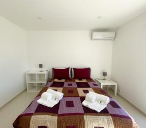 En eller flere senger på et rom på Casa Rosa - Vilamoura