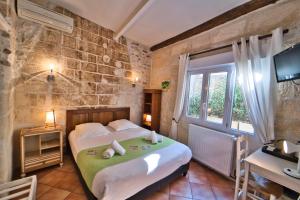 Postel nebo postele na pokoji v ubytování Hôtel La Muette