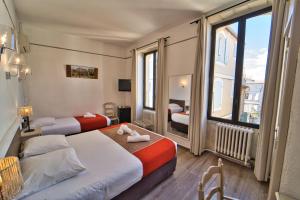 Postel nebo postele na pokoji v ubytování Hôtel La Muette