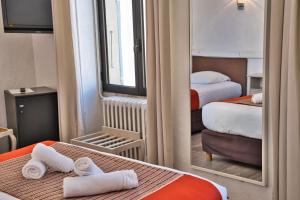 Postel nebo postele na pokoji v ubytování Hôtel La Muette