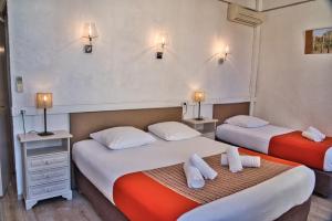 Postel nebo postele na pokoji v ubytování Hôtel La Muette