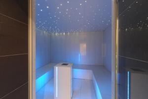 a white room with a ceiling with stars at Alpine Hotel Perren in Zermatt