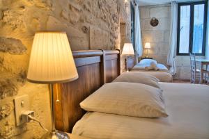 Postel nebo postele na pokoji v ubytování Hôtel La Muette