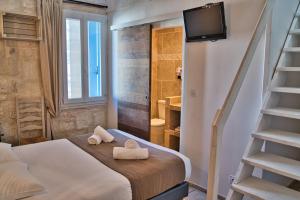 Postel nebo postele na pokoji v ubytování Hôtel La Muette