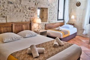 Postel nebo postele na pokoji v ubytování Hôtel La Muette
