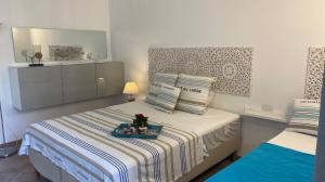 Posteľ alebo postele v izbe v ubytovaní Casa Vacanza sul Mare