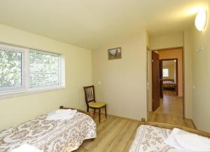 Postel nebo postele na pokoji v ubytování COMMUNE hotel