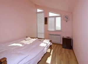 Postel nebo postele na pokoji v ubytování COMMUNE hotel