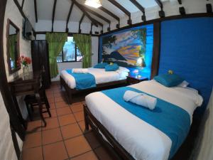 Letto o letti in una camera di Hostal Inti Luna