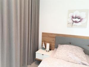 Postel nebo postele na pokoji v ubytování Apartment Jadestrand, Am Alten Deich 4-6, Whg 1 20