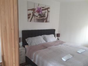Posteľ alebo postele v izbe v ubytovaní Rózsadomb apartman