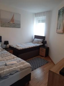 Posteľ alebo postele v izbe v ubytovaní Rózsadomb apartman