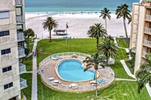 a view of the beach from the balcony of a resort at Jamaica Royale Beach Villa in Siesta Key