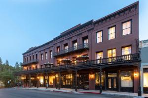 a large brick building with balconies on a street at National Exchange Hotel in Nevada City