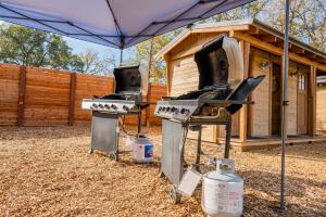 two outdoor bbqurgers in front of a house at Wildhaven Sonoma Glamping in Healdsburg