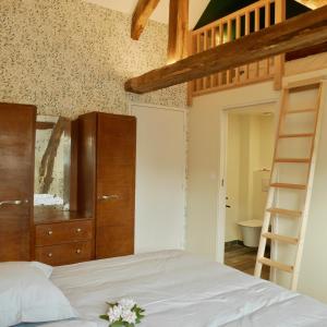 Postel nebo postele na pokoji v ubytování Domaine de la Boderie