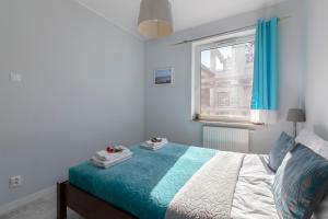 Posteľ alebo postele v izbe v ubytovaní TriApart Amber Jantar V