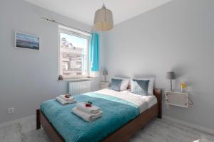 Posteľ alebo postele v izbe v ubytovaní TriApart Amber Jantar V