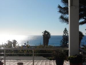 a view of the ocean from a balcony at Villa Giorgos in Kefalos