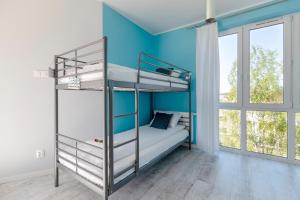 Posteľ alebo postele v izbe v ubytovaní TriApart Amber Jantar V