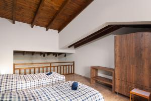 Кровать или кровати в номере Achilles Maisonette